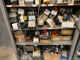 many different types of electrical equipment on the shelves