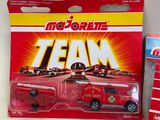 a red toy truck with a team logo on it