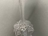 a close up of a necklace on a mannequin mannequin mannequin mannequin mannequin mannequin mannequin mannequin
