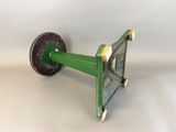 a green object that is on a white surface