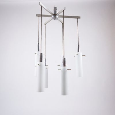 three lights that are hanging from the ceiling in the room