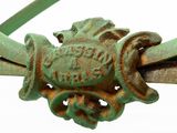 a close up of a metal object with a frog on it ' s head