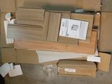 a pile of cardboard and cardboard boxes sitting on the floor