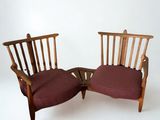 two chairs that are next to each other on a white surface