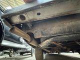 a close up view of a car under a vehicle