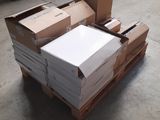 a pile of boxes sitting on a pallet in a warehouse