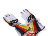 a pair of racing gloves with a flag on them