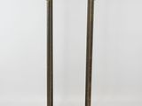 an antique brass coat rack with a wooden top and a metal base