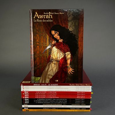 books stacked on top of each other on a gray surface
