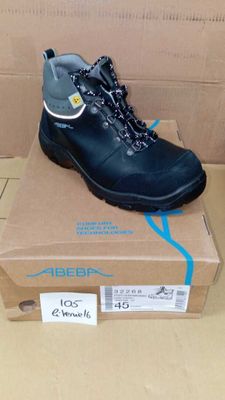the box is full of a pair of black hiking shoes