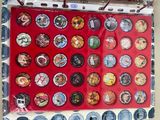 a picture of a display of buttons and magnets on a wall