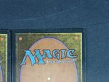 two decks of magic the gathering are shown on a table