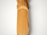 an image of a wooden statue of a woman holding a baby
