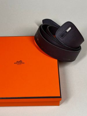 an orange box with a black belt on top of it