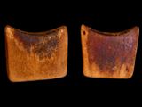 two pieces of wood with rust on them against a black background
