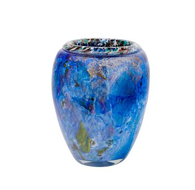 a glass vase with a blue and green design on it