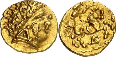 a gold coin with an image of a man riding a horse