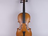 an old violin sitting on a white surface with a white background