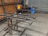 a large metal table in the middle of a warehouse