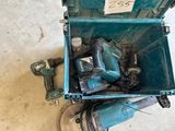 a blue tool box with tools in it on the floor