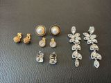 a bunch of jewelry sitting on top of a black table