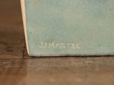 a close up of a book on a wooden table
