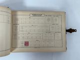 an open book with a picture of a map and a stamp on it