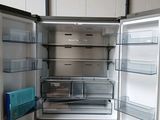 an image of a stainless steel refrigerator with its door open