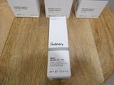 three boxes of ordinary skincare sitting on a table next to each other