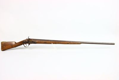 a rifle with a wooden barrel on a white background