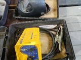 a box of welding equipment sitting on the floor