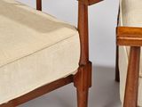 pair of mid century danish teak lounge chairs with upholstered cushions