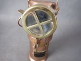 a close up of a small brass object on a table