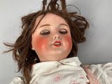 a doll that is laying down on the floor