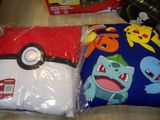two pillows that are sitting on a table