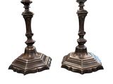pair of antique bronze candlesticks on marble bases