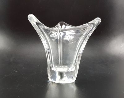 a glass vase that is sitting on a table