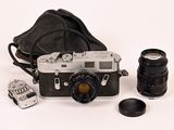 a black and white photo of a camera and some other things