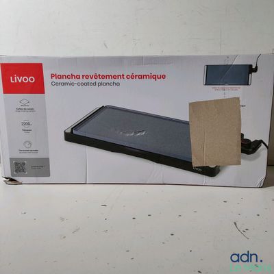 emballage d'une boîte sur laquelle figure l'image d'un ordinateur portable