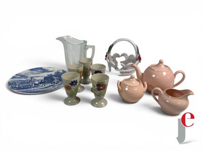 many different types of teapots and cups on the table