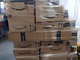 boxes stacked on top of each other on a pallet in a warehouse