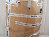 a large cardboard box wrapped in plastic tape on the floor