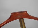 a close up of a wooden coat hanger with a wooden handle