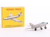 a toy airplane sitting next to a box of dinky toys