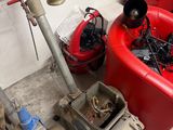a fire hydrant that is sitting next to a red tub