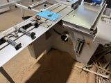 an image of a machine that is working on a piece of wood