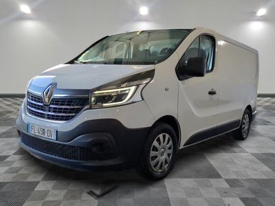 the white van is parked on a checkered floor in a room
