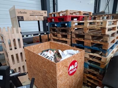 a large box with a lot of pallets in it