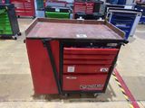 an image of a red tool cart in a garage