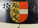 a close up of a helmet with a coat of arms on it